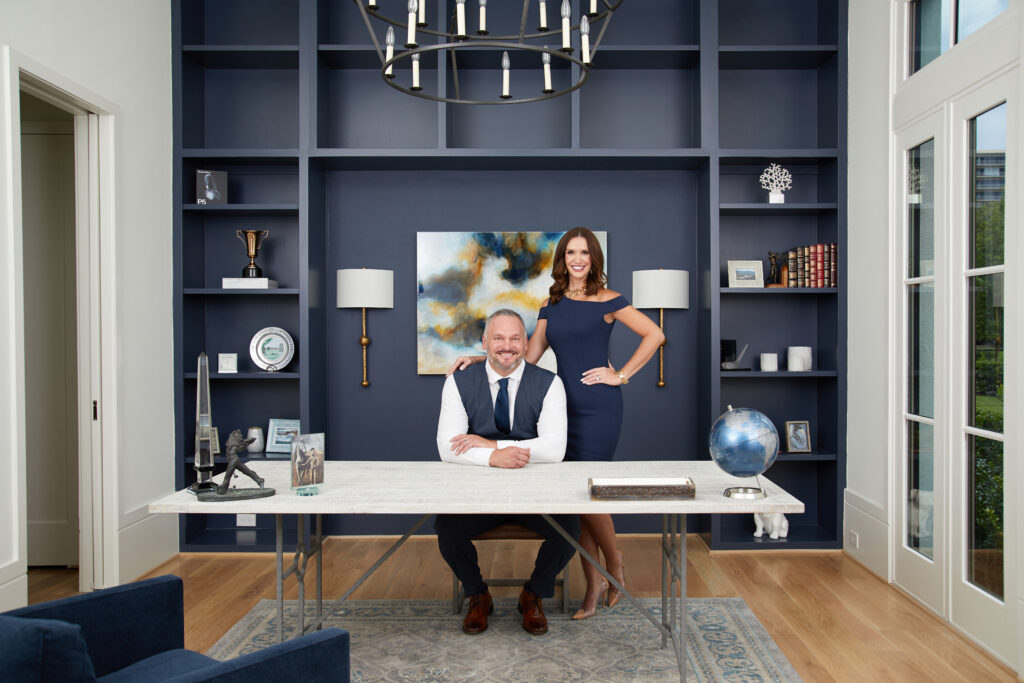 Houston's best headshot photographer Angi Lewis Photography headshot of real estate couple in a blue office